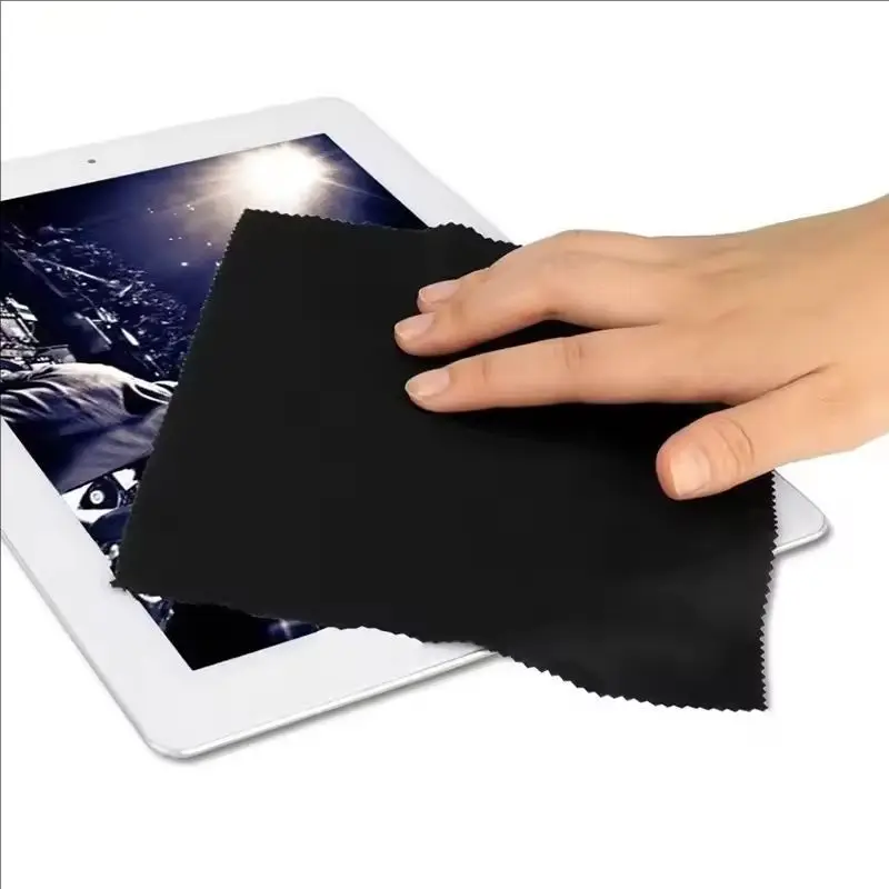 Black and grey lens cloths stacked