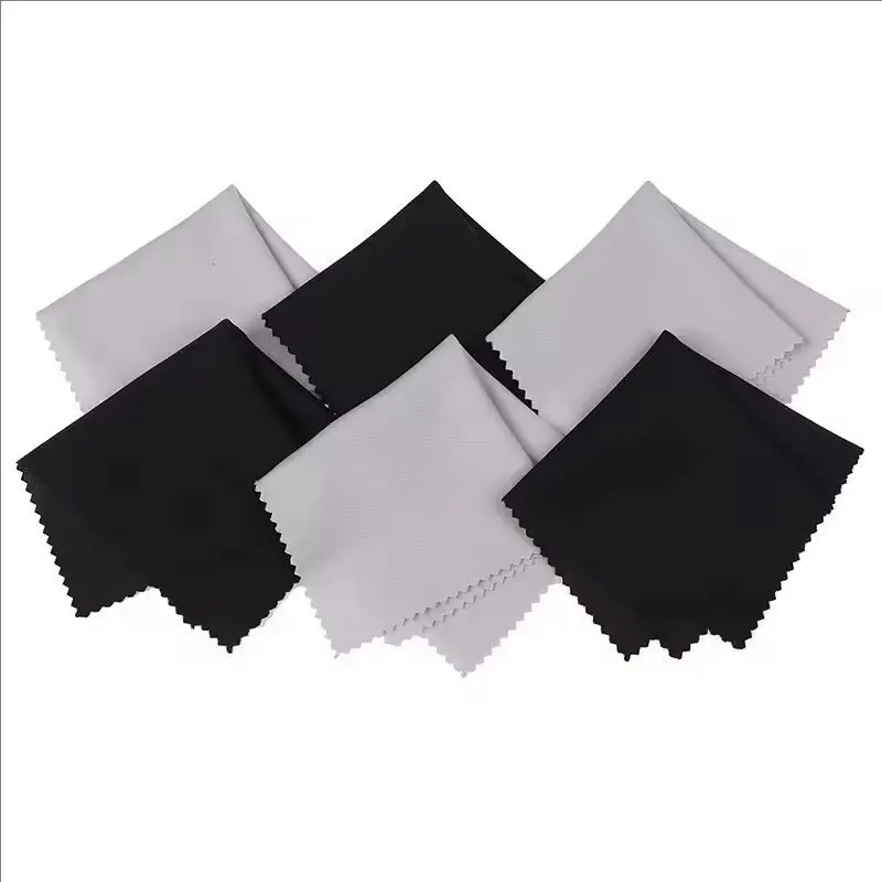 Black and grey lens cloth side by side